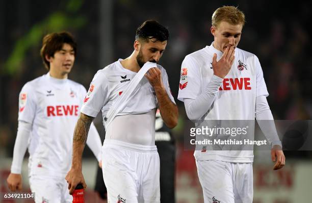 Dominic Maroh and Frederik Soerensen of Koeln are looking dejected after loosing the Bundesliga match between SC Freiburg and 1. FC Koeln at...