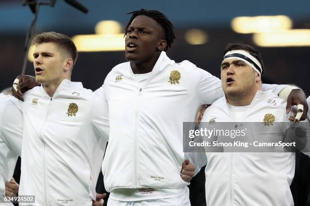 England's Owen Farrell, Maro Itoje, Jamie George sing the national anthem during the RBS Six Nations Championship match between Wales and England at...