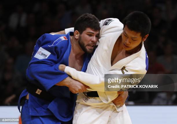 Japan's Kentaro Ilda fights against French Cyrille Maret during the man -100 kg final, on February 12, 2017 at the Accor Hotels Arena in Paris,...