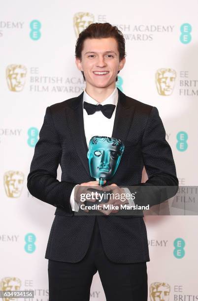Tom Holland, winner of the EE BAFTA Rising Star award, poses in the winners room at the 70th EE British Academy Film Awards at Royal Albert Hall on...
