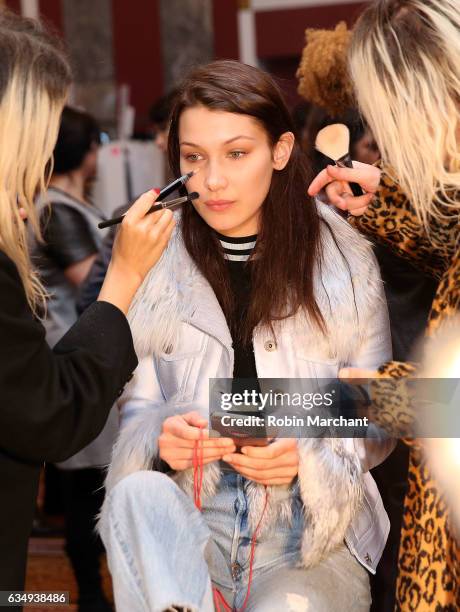 Model Bella Hadid prepares backstage at Sies Marjan during New York Fashion Week on February 12, 2017 in New York City.