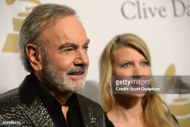 Singer Neil Diamond and wife Katie McNeil attend the Clive Davis annual Pre-Grammy Gala at The Beverly Hilton Hotel on February 11, 2017 in Beverly...