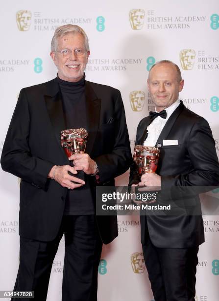 Roy Helland and Daniel Phillips pose with their awards for Hair and Make-Up in the film 'Florence Foster Jenkins' in the winners room at the 70th EE...