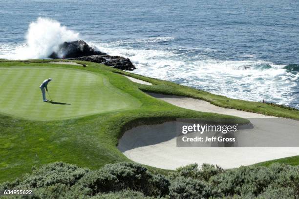 Dustin Johnson putts on the seventh hole during the Final Round of the AT&T Pebble Beach Pro-Am at Pebble Beach Golf Links on February 12, 2017 in...