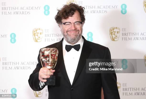 Kenneth Lonergan, winner of the Original Screenplay award for 'Manchester By The Sea', poses in the winners room at the 70th EE British Academy Film...