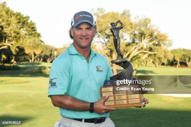 Scott McCarron poses for a picture with the Allianz Championship trophy following the final round of the PGA TOUR Champions Allianz Championship at...