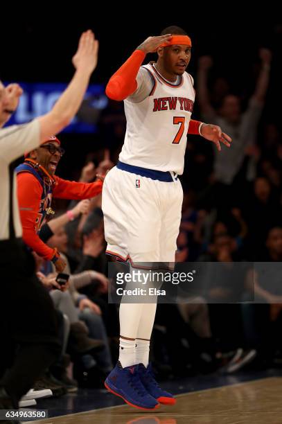 Carmelo Anthony of the New York Knicks celebrates his three point shot in the final minutes of the game against the San Antonio Spurs at Madison...
