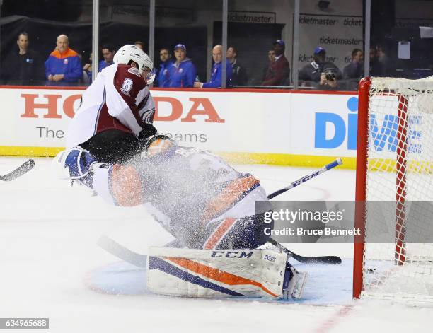 Joe Colborne of the Colorado Avalanche scores a first period goal against Jean-Francois Berube of the New York Islanders at the Barclays Center on...