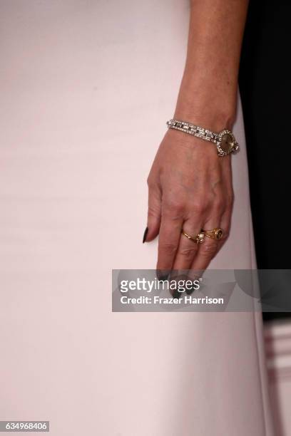 Singer Enya, jewelry detail, attends The 59th GRAMMY Awards at STAPLES Center on February 12, 2017 in Los Angeles, California.