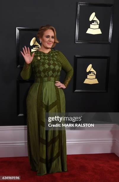 Adele arrives for the 59th Grammy Awards pre-telecast on February 12 in Los Angeles, California. / AFP / Mark RALSTON