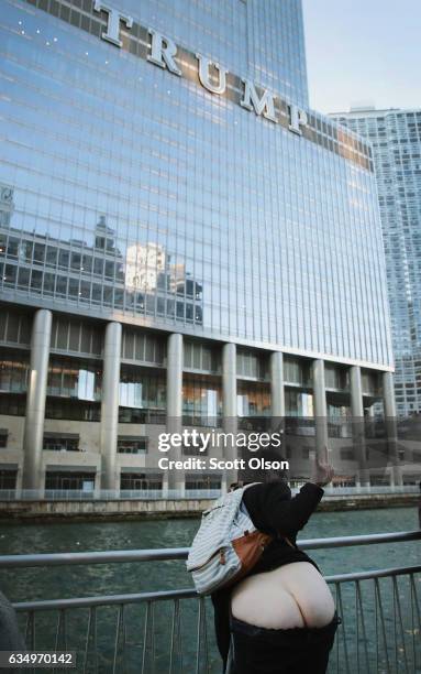 Activists pull down their pants and moon Trump Tower on February 12, 2017 in Chicago, Illinois. The event was staged to protest the policies of...