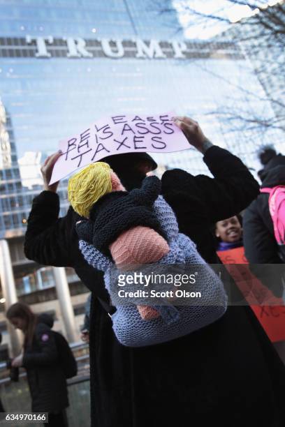 Activists gather across from Trump Tower before pulling down their pants and mooning on February 12, 2017 in Chicago, Illinois. The event was staged...