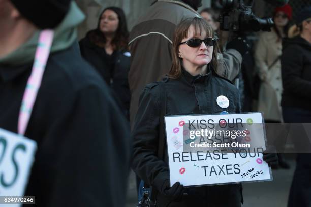 Activists gather across from Trump Tower before pulling down their pants and mooning on February 12, 2017 in Chicago, Illinois. The event was staged...