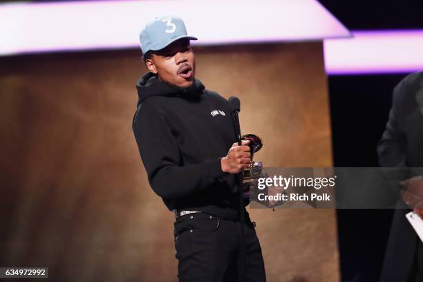 Hip-hop artist Chance the Rapper accepts the Best Rap Performance award for 'No Problem' onstage at the Premiere Ceremony during the 59th GRAMMY...