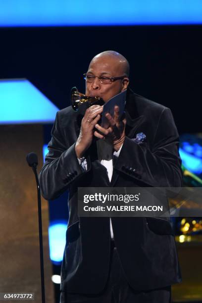 Musician Chucho Valdes receives a Grammy during the 59th Annual Grammy music Awards pre-telecast on February 12 in Los Angeles, California. / AFP /...