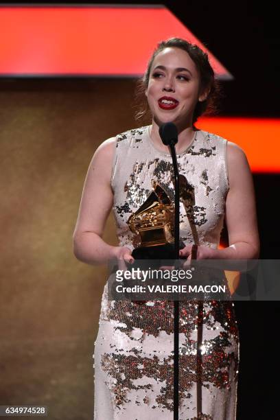 Sarah Jarosz receives a Grammy during the 59th Annual Grammy music Awards pre-telecast on February 12 in Los Angeles, California. / AFP / VALERIE...