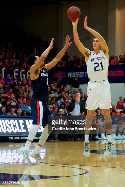 St. Mary's Gaels center Evan Fitzner shoots a three-pointer in front of Gonzaga Bulldogs guard Silas Melson during the second half of the Gaels'...
