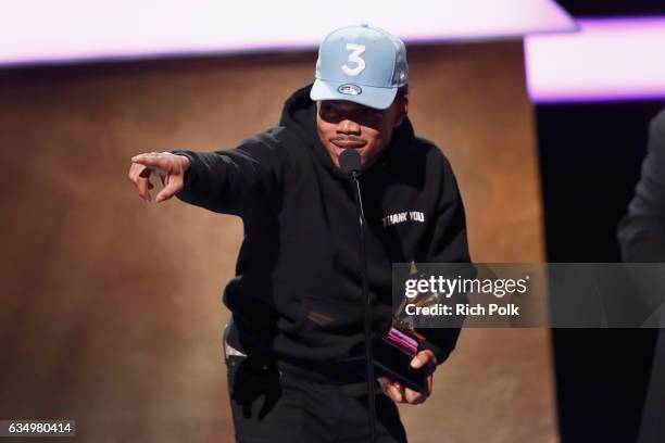 Hip-hop artist Chance the Rapper accepts the Best Rap Performance award for 'No Problem' onstage at the Premiere Ceremony during the 59th GRAMMY...