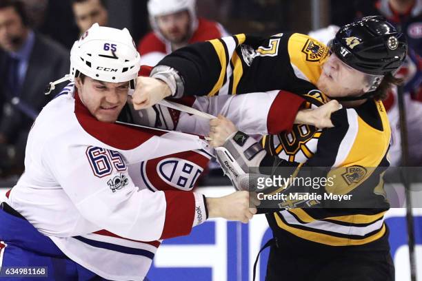 Andrew Shaw of the Montreal Canadiens and Torey Krug of the Boston Bruins fight during the first period at TD Garden on February 12, 2017 in Boston,...