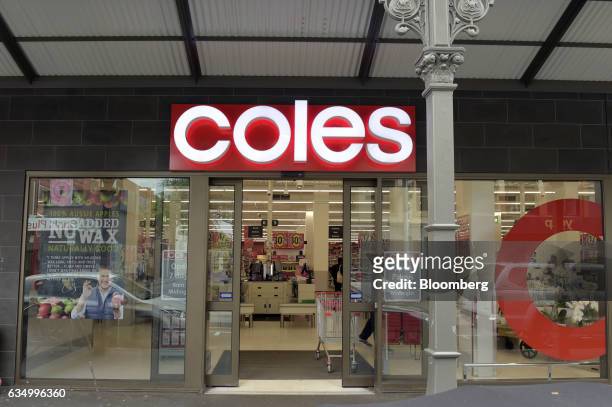 Signage for Coles supermarkets, operated by Wesfarmers Ltd., is displayed at the entrance to a store in the Richmond area of Melbourne, Australia, on...