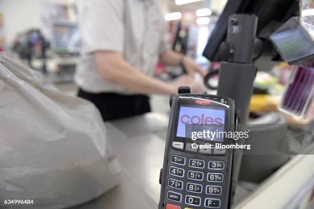 Payment terminal sits at a checkout counter at a Coles supermarket, operated by Wesfarmers Ltd., in the Richmond area of Melbourne, Australia, on...