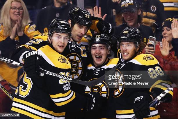 Frank Vatrano of the Boston Bruins celebrates with David Pastrnak, Zdeno Chara and Brandon Carlo after scoring against the Montreal Canadiens at TD...