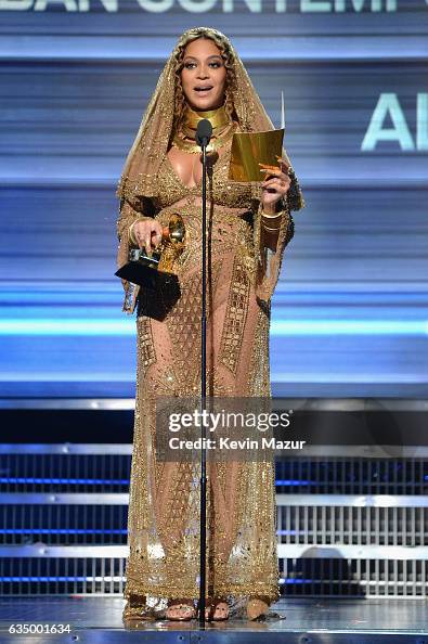 Beyonce accepts award onstage during The 59th GRAMMY Awards at... News ...