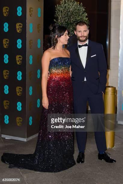 Amelia Warner and Jamie Dornan attend the official after party for the 70th EE British Academy Film Awards at The Grosvenor House Hotel on February...