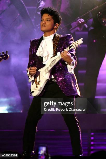 Recording artist Bruno Mars performs a tribute to Prince onstage during The 59th GRAMMY Awards at STAPLES Center on February 12, 2017 in Los Angeles,...