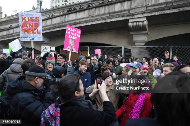 Activists gather across from Trump Tower before pulling down their pants and mooning on February 12, 2017 in Chicago, Illinois. The event was staged...