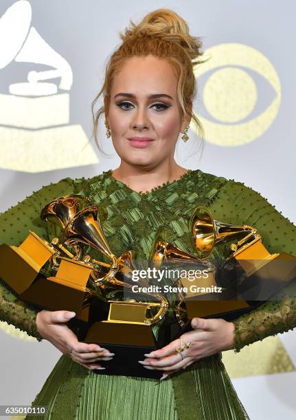 Recording artist Adele, winner of Best Pop Vocal Album, Best Pop Solo Performance, Song of the Year, Record of the Year, and Album of the Year, poses...