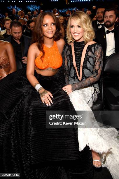 Singer-songwriters Rihanna and Carrie Underwood pose during The 59th GRAMMY Awards at STAPLES Center on February 12, 2017 in Los Angeles, California.