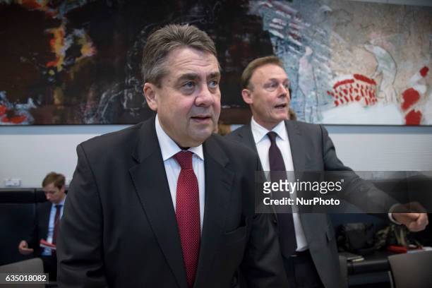 German Foreign Minister Sigmar Gabriel and chairman of the Bundestag SPD faction Thomas Hoppermann arrive at meeting of the SPD faction prior to...