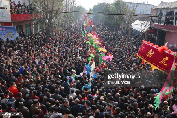 Aerial view of villagers crowding to watch Shehuo parades at Feng Village on February 12, 2017 in Xi An, Shaanxi Province of China. "Shehuo"...