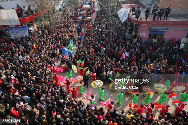 Aerial view of villagers crowding to watch Shehuo parades at Feng Village on February 12, 2017 in Xi An, Shaanxi Province of China. "Shehuo"...