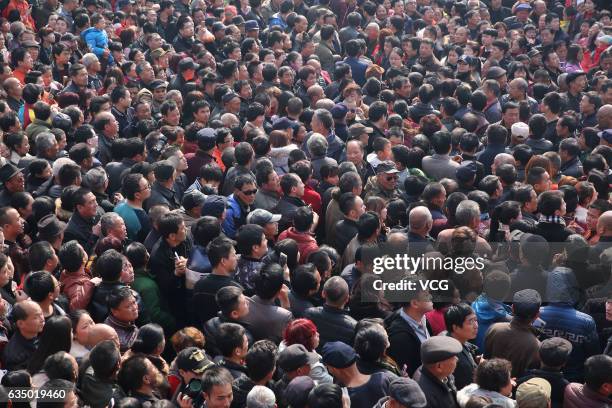 Aerial view of villagers crowding to watch Shehuo parades at Feng Village on February 12, 2017 in Xi An, Shaanxi Province of China. "Shehuo"...