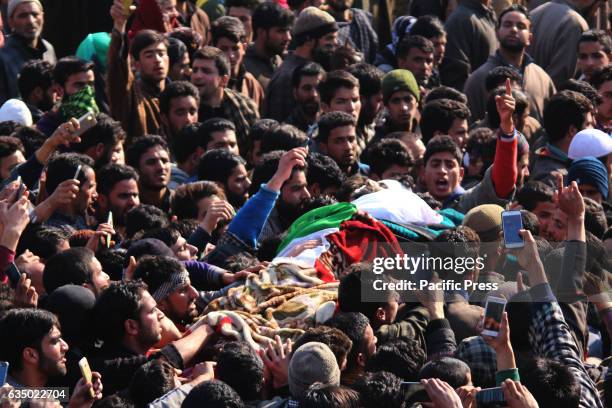 Kashmiris carry body of slain rebel, Mudasir Ahmed, in Redwani Kulgam south of Kashmir. Indian controlled Kashmir .Hundreds of mourners attended the...