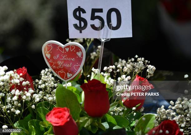 Roses are seen for sale for Valentine's Day in Sydney on February 13, 2017. Love may be in the air on February 14 but St. Valentine's Day is also...