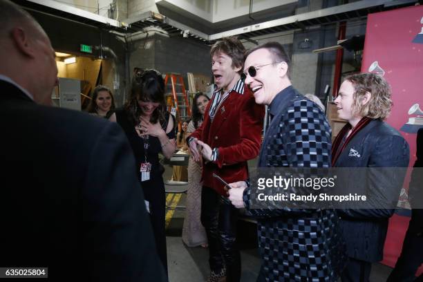 Musicians Matt Shultz, Brad Shultz and Jared Champion of Cage the Elephant pose with the Best Rock Album award backstage at the Premiere Ceremony...