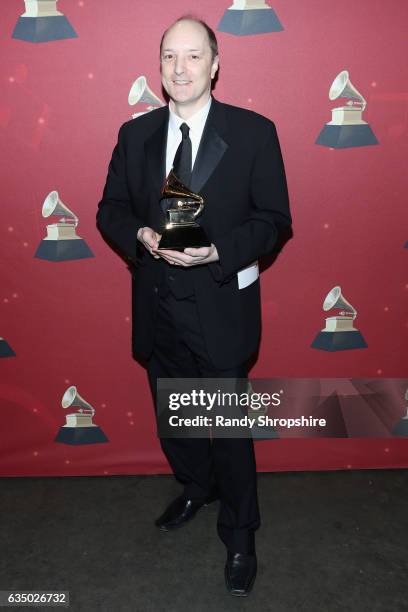 Producer David Frost poses with the Producer of the Year, Classical award backstage at the Premiere Ceremony during the 59th GRAMMY Awards at...