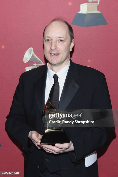 Producer David Frost poses with the Producer of the Year, Classical award backstage at the Premiere Ceremony during the 59th GRAMMY Awards at...