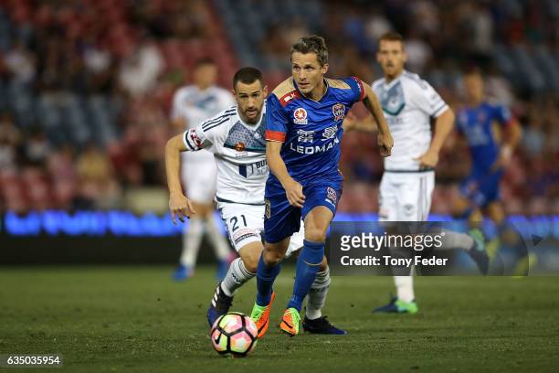 Morten Nordstrand of the Jets controls the ball from Carl Valeri of the Victory during the round 19 A-League match between the Newcastle Jets and...