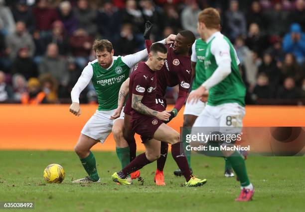 Esmael Goncalves of Heart of Middlothian vies with Grant Holt of Hibernian during the Scottish Cup Fifth Round match between Heart of Midlothian and...