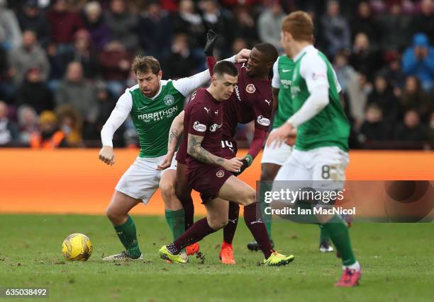 Esmael Goncalves of Heart of Middlothian vies with Grant Holt of Hibernian during the Scottish Cup Fifth Round match between Heart of Midlothian and...