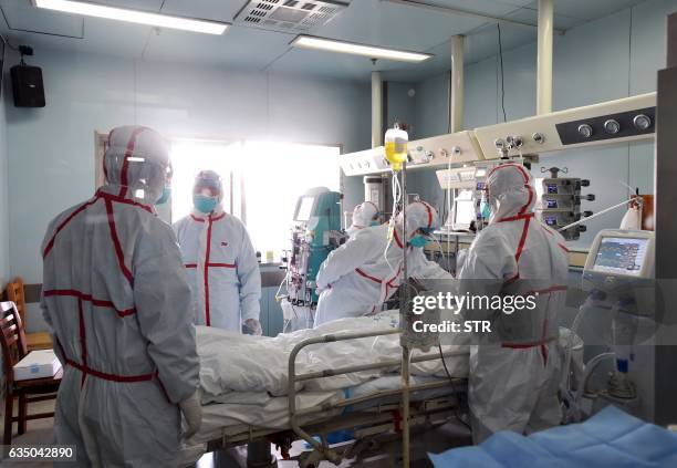 This photo taken on February 12, 2017 shows an H7N9 bird flu patient being treated in a hospital in Wuhan, central China's Hubei province. A number...