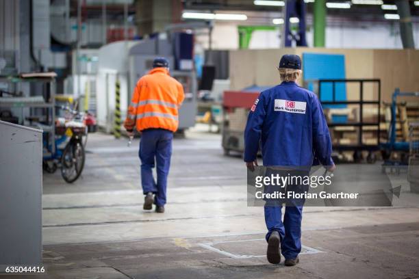 Neumuenster, Germany Two workers run through the railway plant in Neumuenster on February 07, 2017 in Neumuenster, Germany.