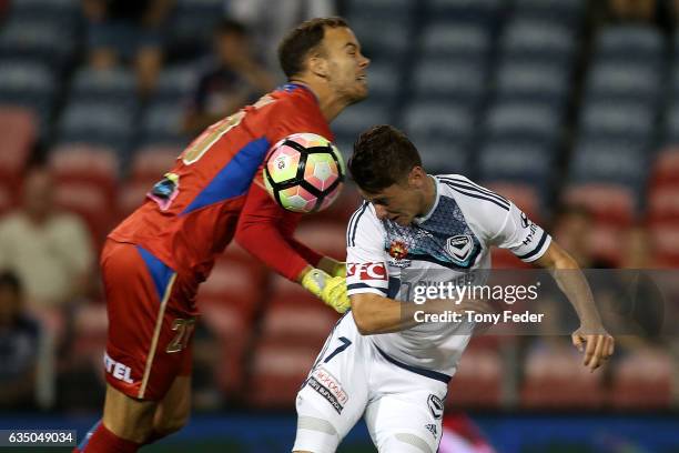 Marco Rojas of the Victory attempts to head the ball past Jack Duncan of the Jets during the round 19 A-League match between the Newcastle Jets and...