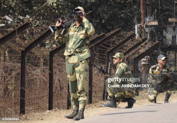 In this photograph taken on February 9 Indian Border Security Force personnel take part in a routine patrol near the India-Bangladesh border in the...