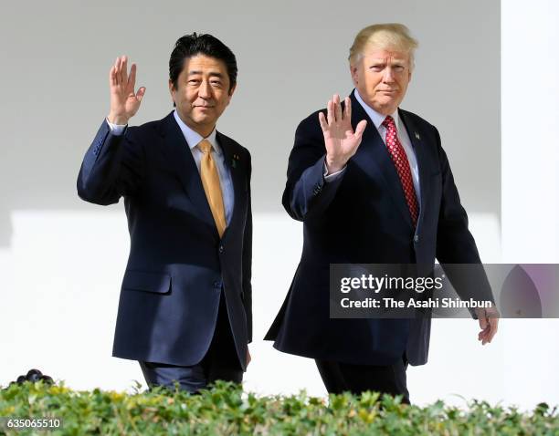 Japanese Prime Minister Shinzo Abe and U.S. President Donald Trump walk together to their joint press conference in the East Room at the White House...