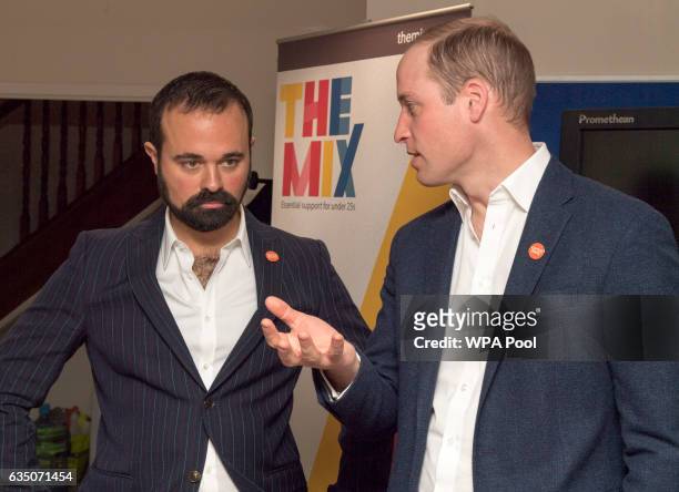 Prince Willaim, Duke of Cambridge speaks with Evgeny Lebedev as he officially launched the Centrepoint Helpline in London on February 13, 2017 in...